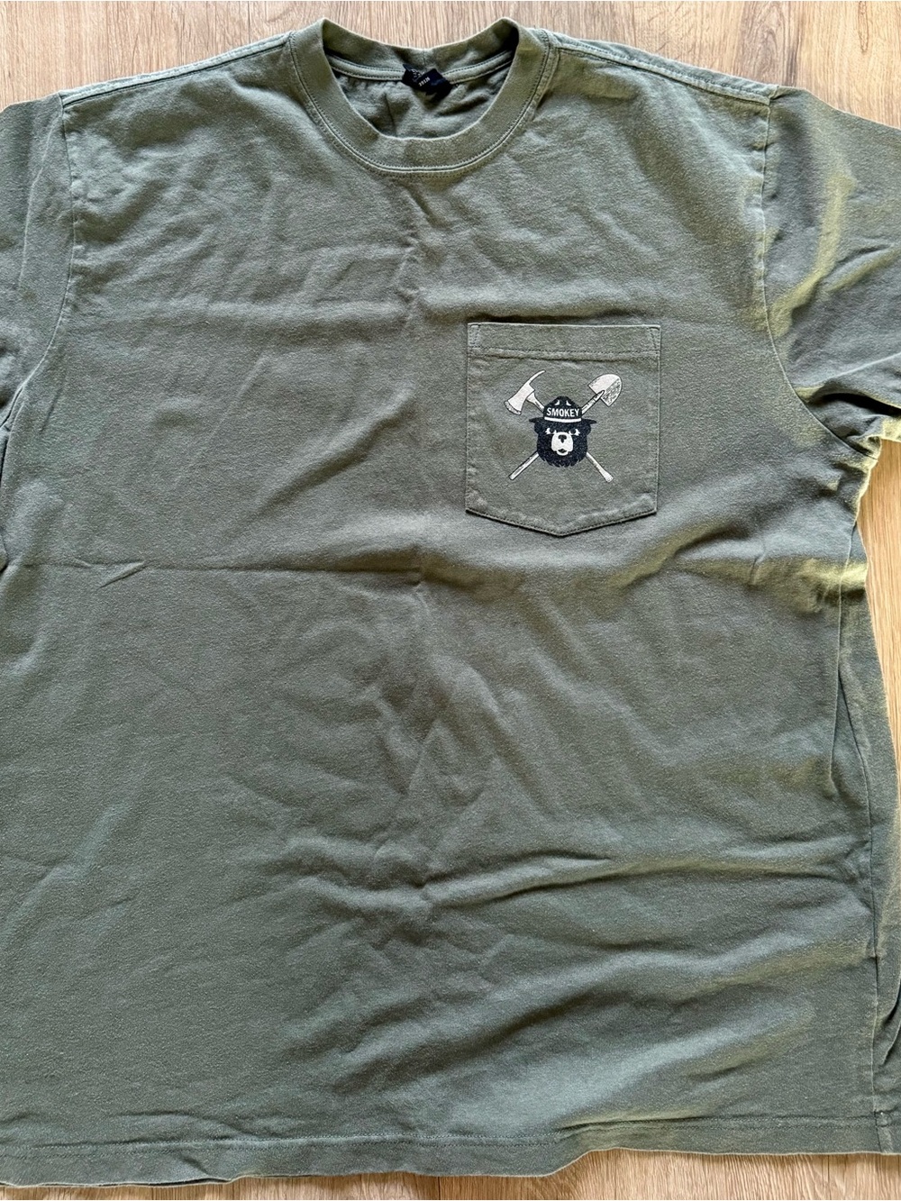 Men's Smoky the Bear Olive Green Pocket Tee with Axe & Shovel Graphic